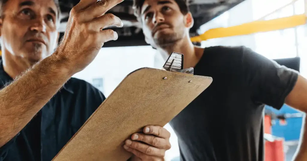 2 experts checking a garage door